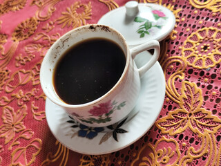 Coffee in a classic cup on the table,