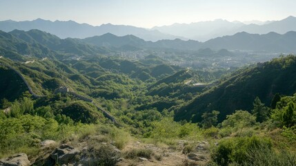 Naklejka premium Stunning Panoramic View of Lush Green Mountains in Daylight with Clear Blue Sky and Serene Landscape in the Distance, Perfect for Nature and Travel Themes