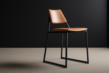 a close up of a chair with a leather seat and a metal frame