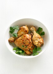 Fototapeta premium Baked chicken meat with herbs in bowl