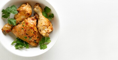 Baked chicken meat with herbs in bowl