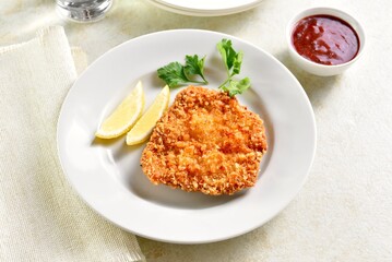 Homemade breaded chicken schnitzel