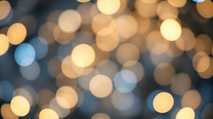 Obraz premium A de-focused abstract background featuring shimmering glitter lights in blue, gold, and black hues.