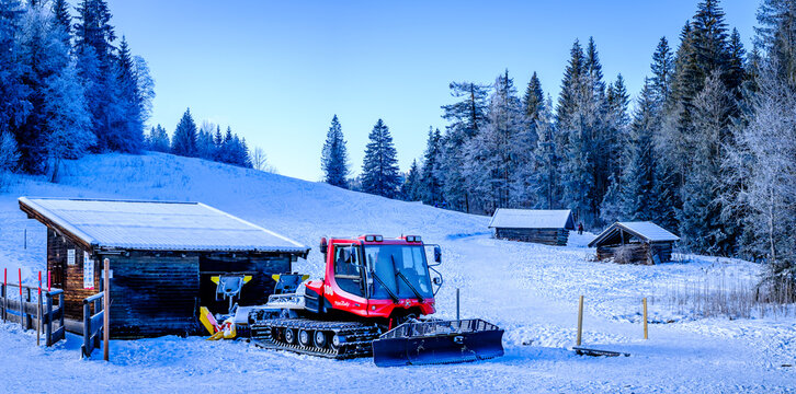 Upper bavaria, Germany - january 5: typical snowcat with snow plough in upper bavaria on January 5, 2021