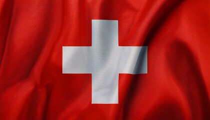 Top view of a Swiss flag on a white surface, featuring ample empty space for text