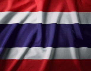 Naklejka premium A flag of Thailand is flying in the sky. The flag is red, white, and blue