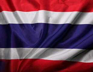 Obraz premium A flag of Thailand is flying in the sky. The flag is red, white, and blue