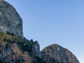 Rocky mountain on a blue sky background with copy space