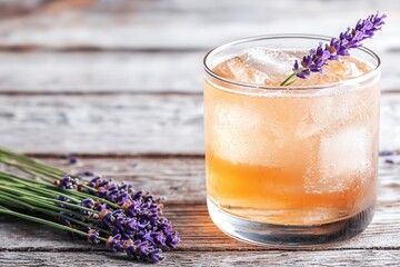 Fototapeta premium Herbal mixology enhances cocktail flavors. Lavender cocktail with ice and flowers on rustic wooden surface.