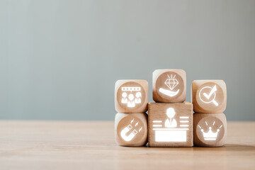 Wooden blocks with icons representing employer branding, showcasing modern workplace culture and...
