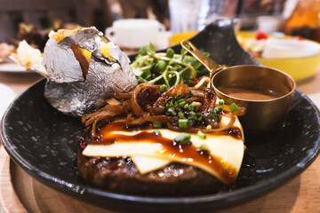 Beef with potatoes and vegetables on a plate