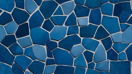 The image shows a seamless pattern of irregularly shaped, blue tiles, reminiscent of a mosaic or a cracked surface, with thin, light gray grout lines between each piece.