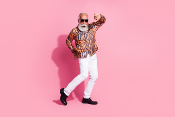 Photo of cool funky old man moving dancing night club wear shiny shirt isolated pastel color background