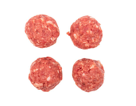 Four raw meatballs isolated on transparent background