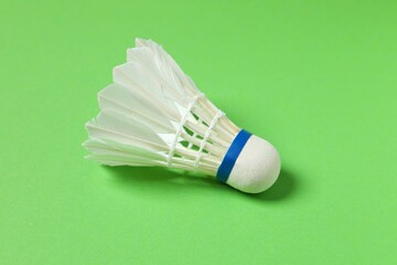 Badminton shuttlecock on color background