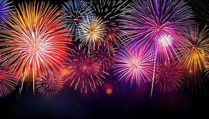 Obraz premium Colorful Fireworks Illuminate New Year's Eve Festivities- A Vibrant Holiday Background for G