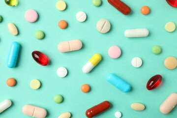 Various pills on a colored background