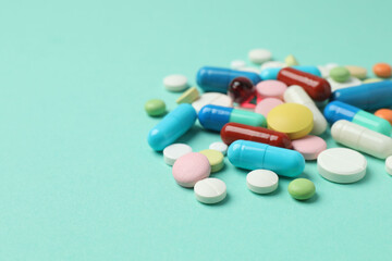 Various pills on a colored background