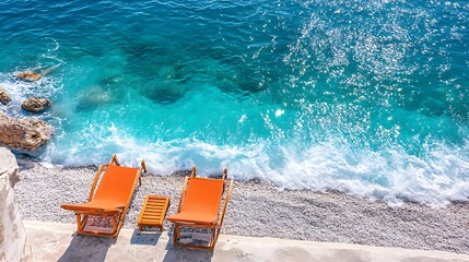 Fototapeta premium Vibrant Coastal Photo: Two Sun Loungers Gracefully Resting Beside Sparkling Turquoise Waves. AI Generated