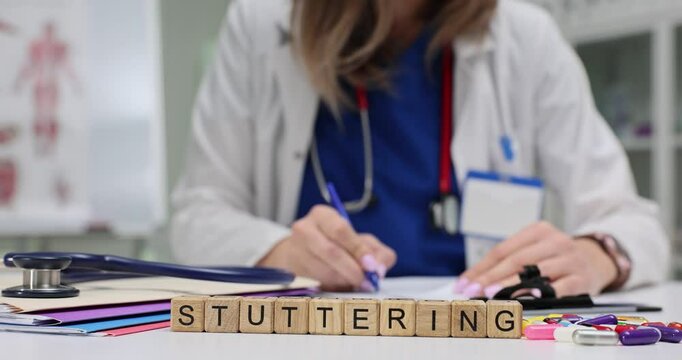 A healthcare professional evaluating and assessing stuttering using specialized tools in a clinical medical setting