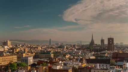BARCELONA, SPAIN - NOVEMBER 9, 2024: City skyline viewed from high above at sunset showcasing historic architecture and vibrant urban life