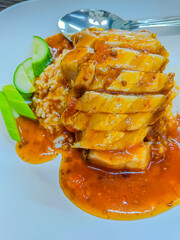 Crispy pork with rice and sauce, thai style.