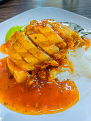 Crispy pork with rice and sauce, thai style.