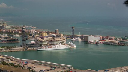 BARCELONA, SPAIN - NOVEMBER 9, 2024: Aerial view of harbor showcasing yachts, skyline, and vibrant activity along the coastline