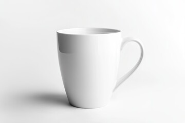 Fototapeta premium A white ceramic coffee mug featuring a handle is placed on a white surface