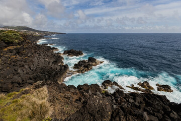 Amazing Atlantic ocean waves and rocks at Pico island Azores Portugal