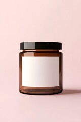 Photo of a blank label on the front, mockup style, for packaging design. In front is an amber glass candle jar with a black lid