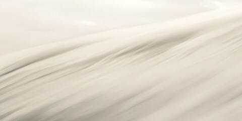 Obraz premium Abstract beige fabric texture with soft folds and smooth lines.