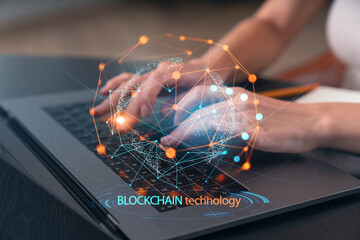 Woman typing on laptop at office workplace in background. Concept of working process, internet surfing, online business education. Student send e-mail. Close up view. Blockchain icons