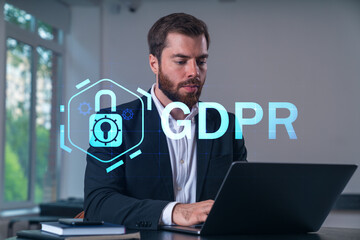 Smiling businessman in formal wear working on laptop at office workplace with smartphone and notebooks. Concept of successful business deal, agreement. datum security icons.