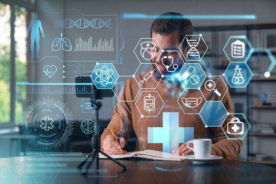 Happy man is making video blog using smartphone on a tripod explaining, teaching, master class people in room. Concept of online stream, business education, conference call. Healthcare seminar