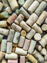 Stacking wine cork background with various vintage years