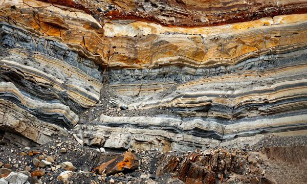 Strata of rock layers in sedimentary cliff