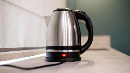 Electric kettle on a modern kitchen counter. Concept: blending technology and convenience, offering...
