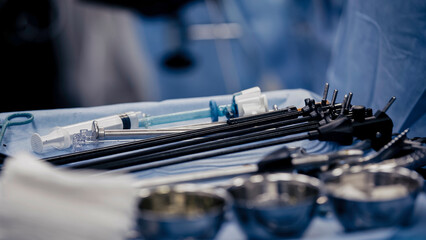 Surgical instruments. Several surgical instruments on the table in the operating room. Modern medical concept, surgery and modern medical technologies.