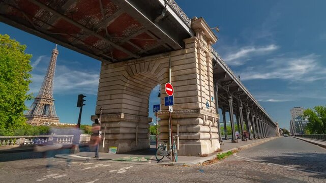 PARIS, FRANCE - OCTOBER 28, 2024: View of the iconic bridge structure and traffic under blue skies in Paris during autumn