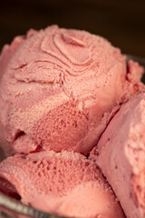 delicious sweet cold raspberry-flavored ice cream and ripe raspberries in a glass