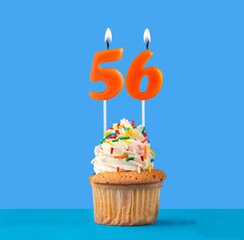 Orange birthday candle and cupcake - Number 56