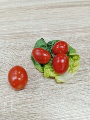 tomato cherry and green vegetable on the table