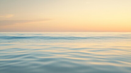 Calm ocean waves under a serene sunset sky.