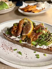 Aesthetic and very delicious toast with salmon and avocado prepared with care