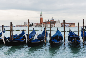 Fototapeta premium Venetian Gondolas with San Giorgio Maggiore Church and Campanile in the Background