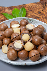 Australian Queensland macadamia nuts, or bush, maroochi, bauple nut, with sawn nutshell, fresh harvest