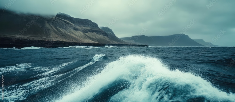 Aufkleber view of turbulent waves hitting a coastal harbour wall with dramatic cliffs under a moody sky observ