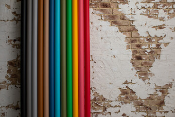 Colorful paper backgrounds on brick wall background