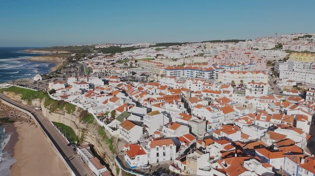 Revealing aerial shot of the coastal village of Ericeira. Portugal